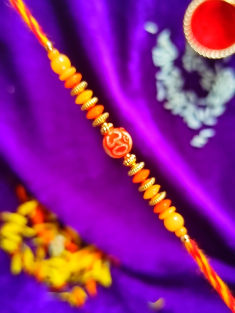 

CRAYTON Men Orange Colored Om Rakhi