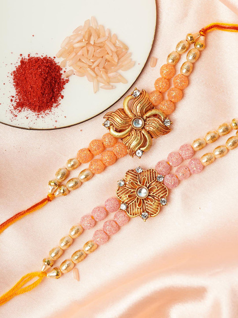

Urmika Set of 2 Orange & Peach Coloured Floral Rakhi With Roli Chawal