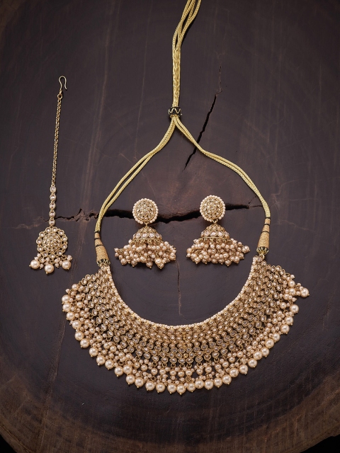 

Kushal's Fashion Jewellery Gold Plated Champagne White Kundan Studded Jewellery Set