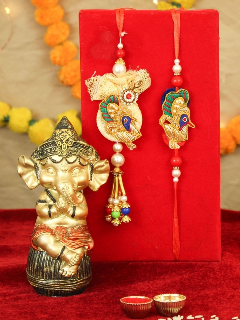 

TIED RIBBONS Multi-Coloured Bhaiya Bhabhi Lumba Rakhi Combo with Ganesha Idol Combo Gift
