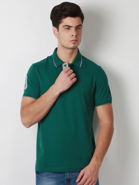

Peter England Men Green Solid Polo Collar T-shirt