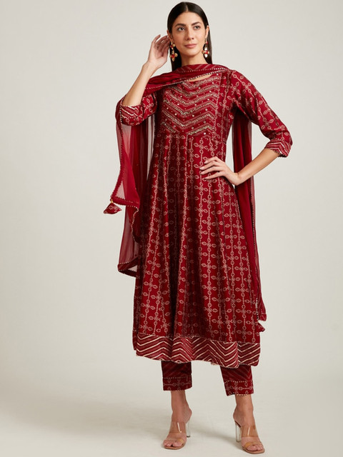 

Neerus Women Maroon Printed Pleated Mirror Work Kurti With Churidar & Dupatta