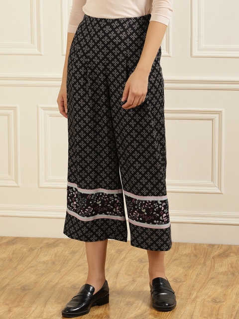 

Ted Baker Women Black Printed Flared Trousers