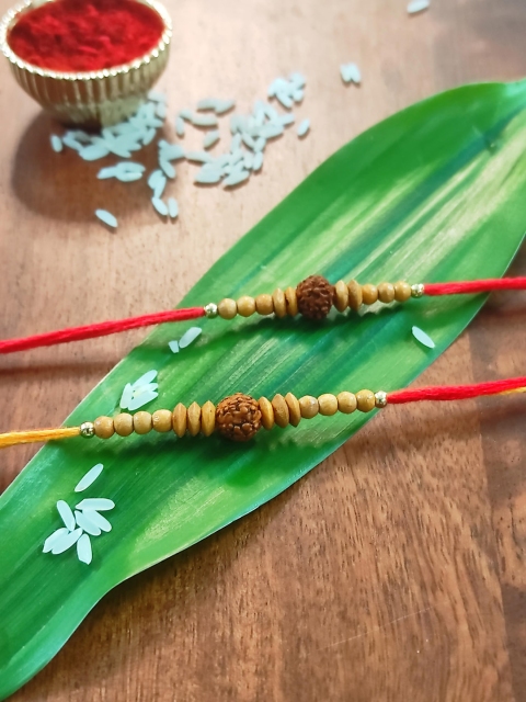 

CRAYTON Set of 2 Beige & Red Rakhi with Roli Chawal