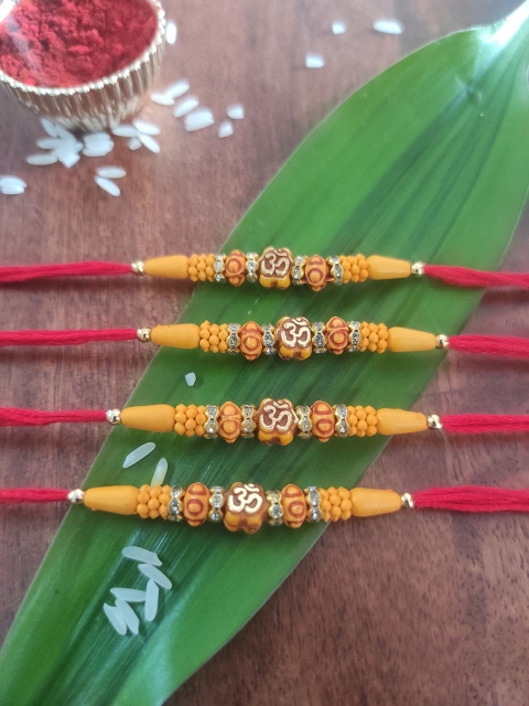 

CRAYTON Set Of 4 Yellow & Beige Beaded Rakhis