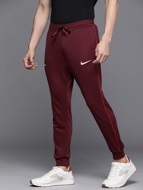 

Nike Men Maroon Brand Logo Printed Mid Rise Dri-Fit Libero Soccer Joggers