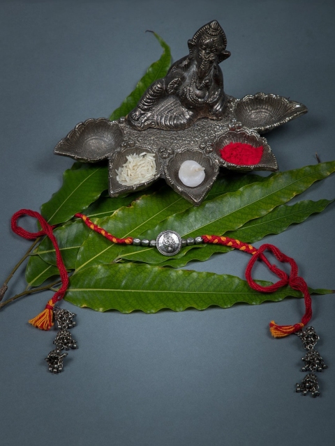 

creyons by mansi Orange Lord Ganesha Handmade Lumba Rakhi