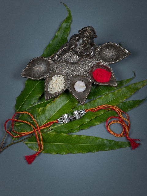 

creyons by mansi Orange & Silver-Toned Bhaiya Rakhi