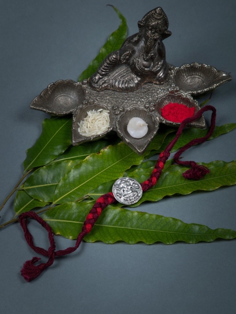 

creyons by mansi Men Red & Silver Toned Beaded Rakhi
