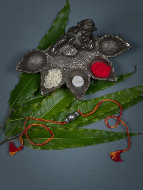 

creyons by mansi Men Orange Lord Ganesha Handmade Rakhi With Roli Chawal