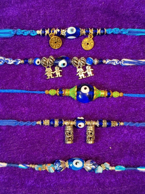 

CRAYTON Men Set Of 5 Blue & Gold-Toned Evil Eye Rakhi