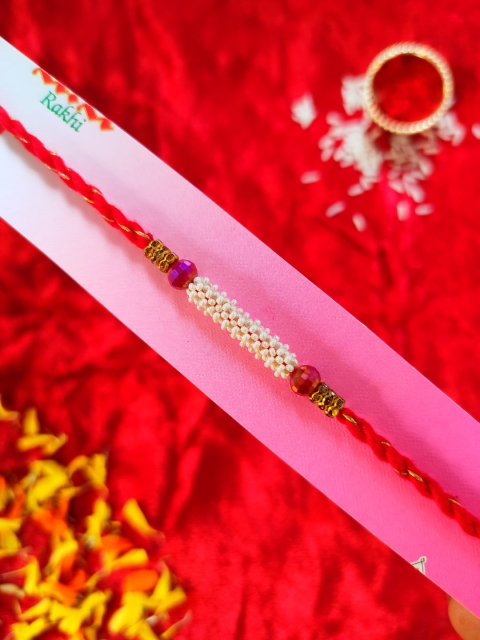 

CRAYTON Men Red Threaded & White Pearl Designed Rakhi