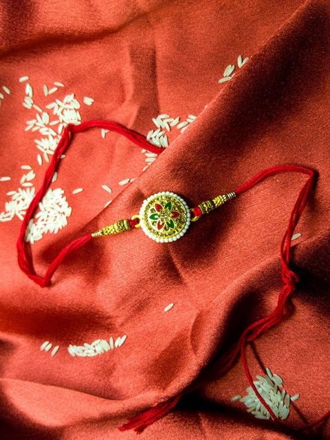 

CRAYTON Red Meenakari Design Pearl & Diamond Studded Tie-Up Rakhi