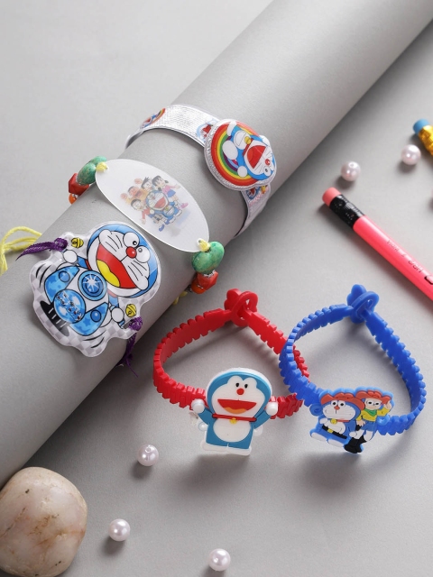 

Aapno Rajasthan Set Of 5 Blue & White Doremon-Charm Rakhi With Roli Rice & Rakhi Card
