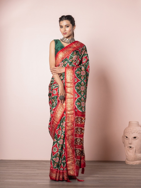 

Exclusiva Green & Red Ethnic Motifs Silk Blend Patola Saree