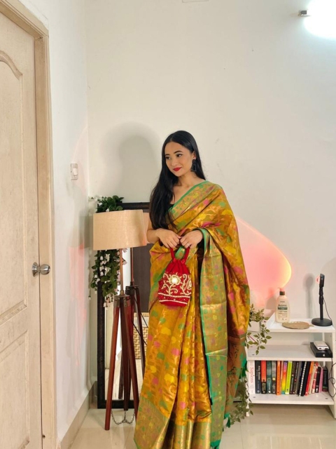 

Mitera Mustard & Green Floral Zari Organza Kanjeevaram Saree