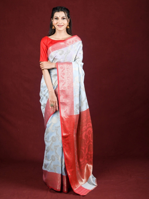 

Exclusiva Blue & Red Floral Woven Design Zari Saree