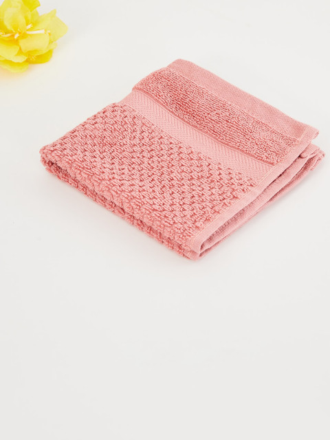

Home Centre Peach Cotton Textured Face Towel