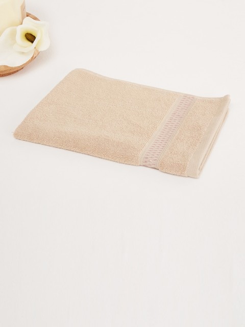 

Home Centre Beige Solid 450 GSM Cotton Hand Towel