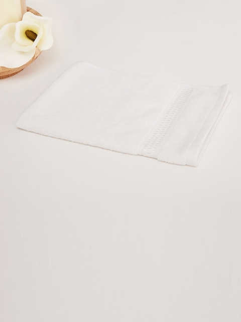 

Home Centre White Solid 450GSM Cotton Face Towel