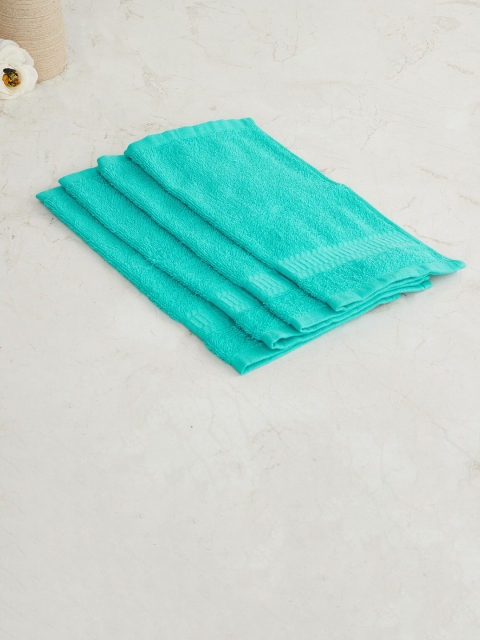 

Home Centre Set Of 4 Turquoise Blue Solid 550 GSM Cotton Face Towels