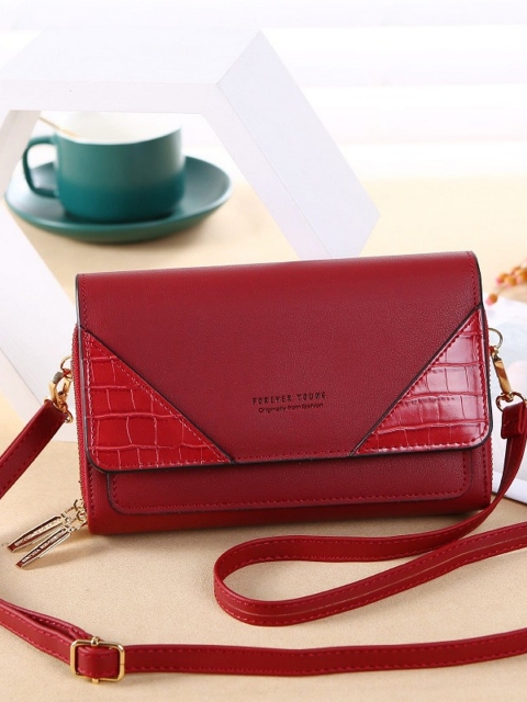 

Diva Dale Maroon PU Structured Sling Bag with Tasselled