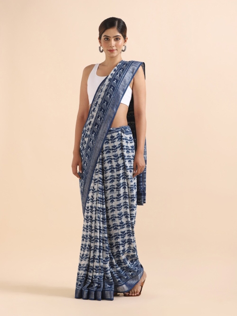 

Taneira Blue & Off White Ethnic Motifs Zari Bagru Saree