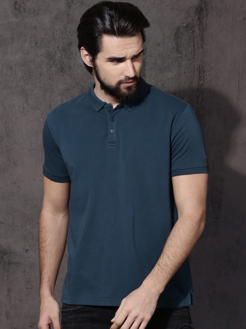 

Roadster Men Teal Solid Polo Collar T-shirt