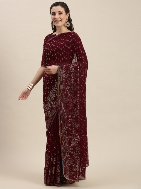 

Amrutam Fab Maroon Embellished Pure Georgette Saree