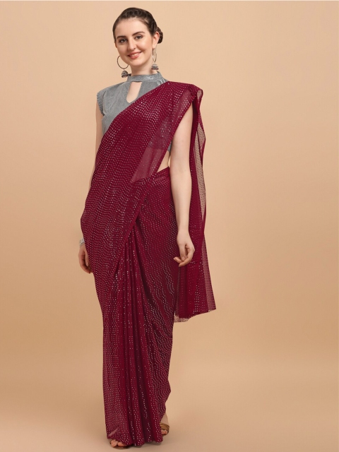 

Amrutam Fab Maroon Embellished Pure Georgette Saree