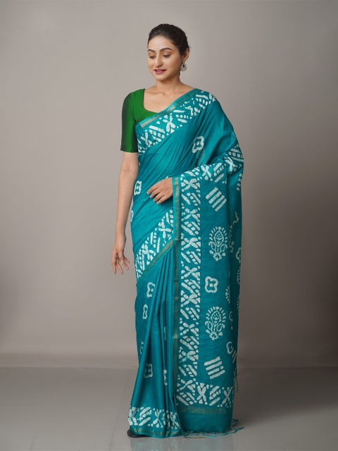 

Unnati Silks Turquoise Blue & White Batik Printed Zari Silk Blend Chanderi Saree