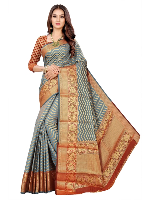 

Rivana Grey & Orange Woven Design Zari Kanjeevaram Saree