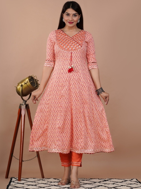 

UNISETS Women Coral Ethnic Motifs Printed Empire Kurti with Trousers & With Dupatta