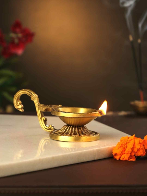 

Amoliconcepts Gold-Toned Diya with Swan Handle