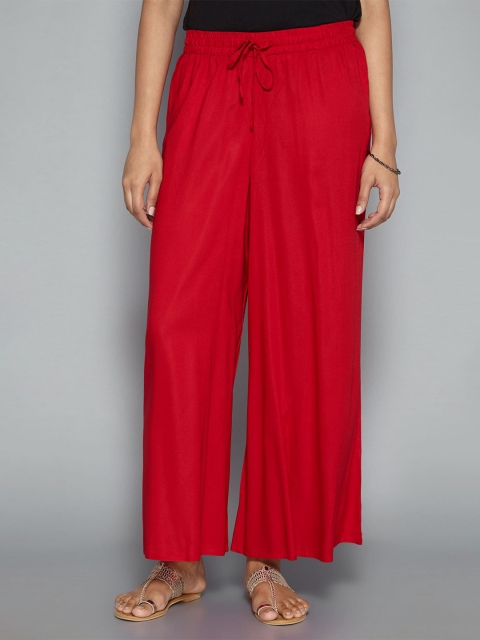 

Pistaa Women Red Solid Flared Palazzos