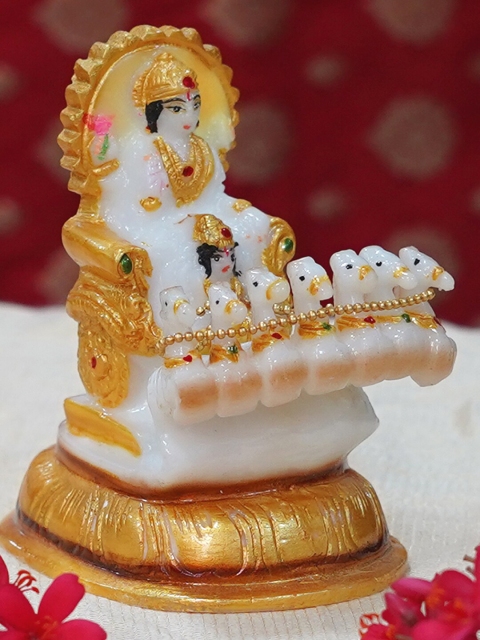 

Gallery99 White & Gold-Toned Surya Dev idol Showpiece