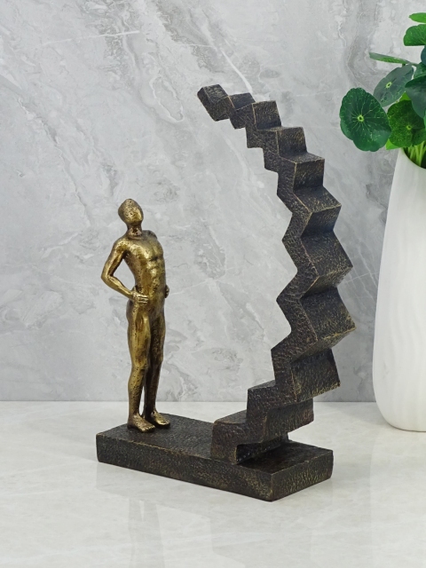 

HomeTown Brown & Gold Man On Staircase Showpieces