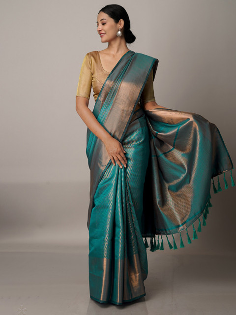 

Unnati Silks Teal & Copper Woven Design Zari Silk Blend Banarasi Saree