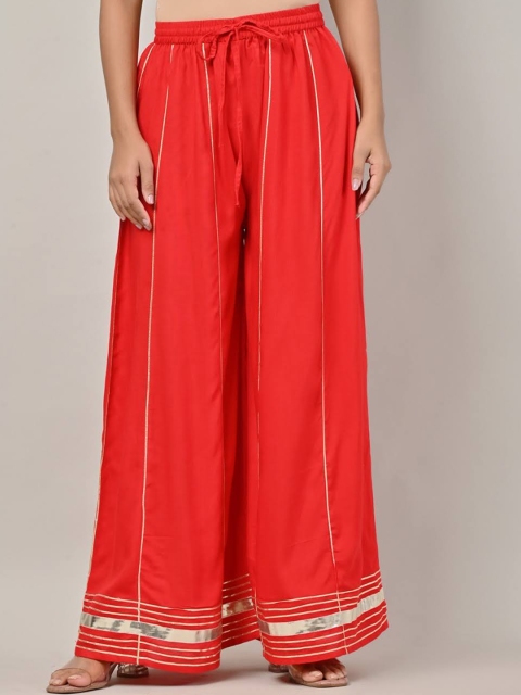 

Swasti Women Orange & Silver-Toned Striped Flared Lace Palazzos