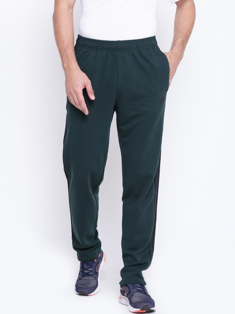 

ADIDAS Men Green Essentials 3 Stripes FT Track Pants