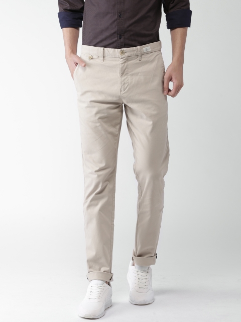 

Tommy Hilfiger Men Beige Slim Fit Self-Design Chinos
