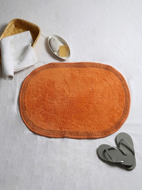 

House This Orange Oval Textured Cotton Bath Rug