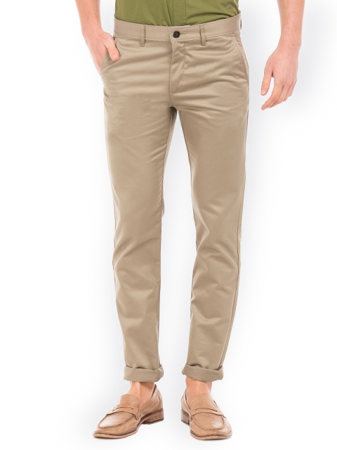 

Arrow Sport Men Khaki Solid Regular Trousers