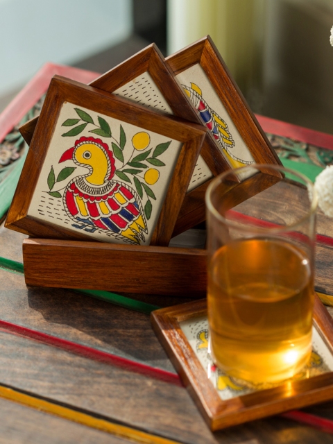 

ExclusiveLane Brown 4 Pieces Square Hand-Painted Teakwood Coaster Set with Stand