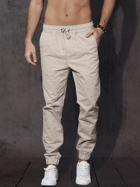 

Roadster Men Beige Regular Fit Printed Joggers