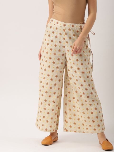 

IMARA Women Beige Flared Printed Palazzos