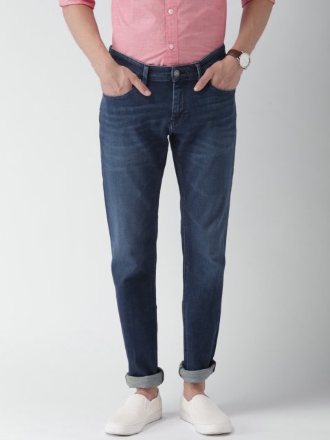 

Tommy Hilfiger Men Blue Slim Fit Mid-Rise Clean Look Stretchable Jeans
