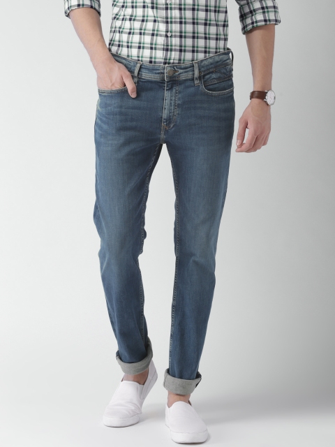 

Tommy Hilfiger Men Blue Fitted Slim Fit Mid-Rise Clean Look Stretchable Jeans