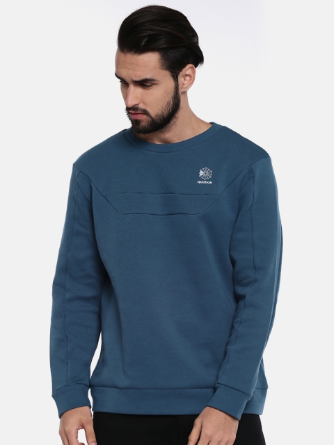 

Reebok Classic Men Blue Solid Sweatshirt