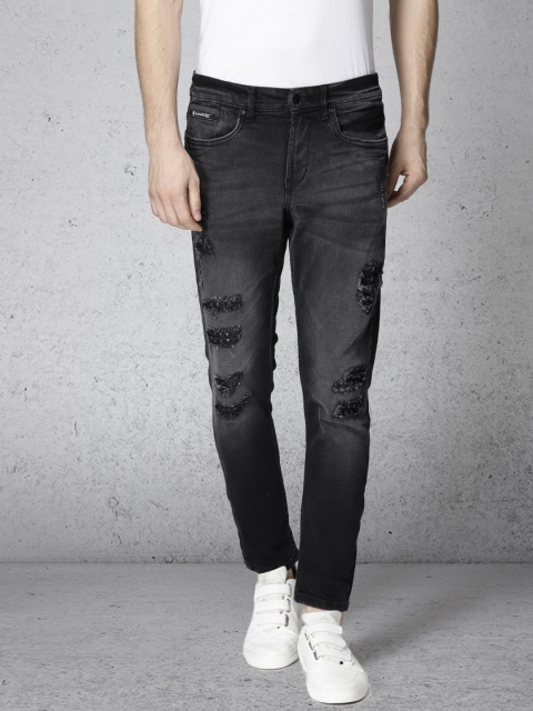 

Ecko Unltd Men Black Tapered Fit Mid-Rise Mildly Distressed Embellished Stretchable Jeans